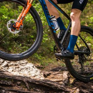 Mountain biker with Charge Pro shoes