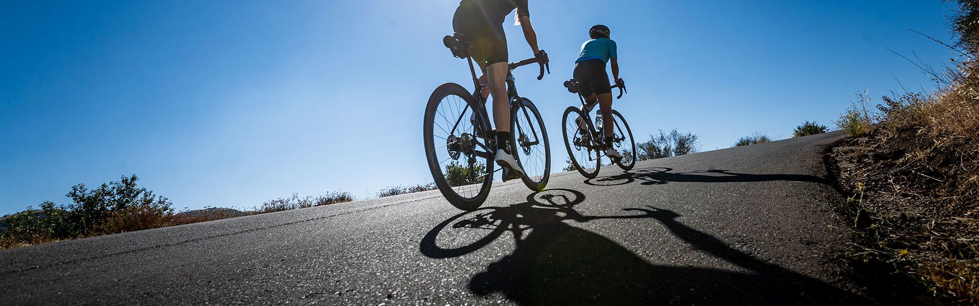 Liv riders cycling up hill