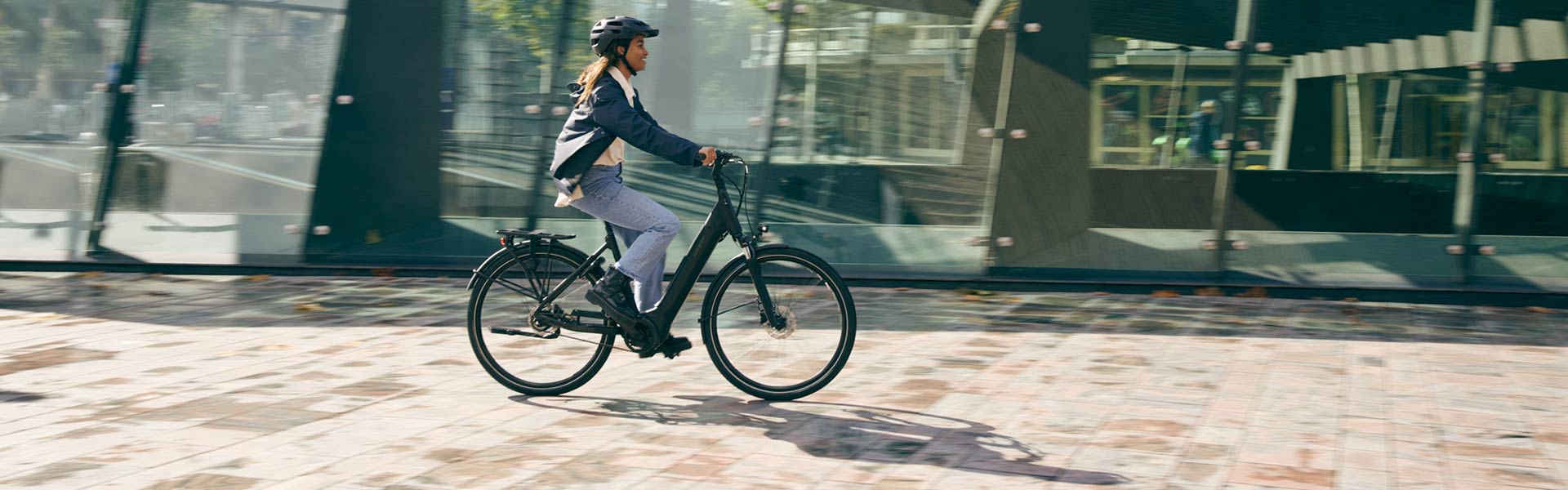 Woman cycling on an electric bike in the city