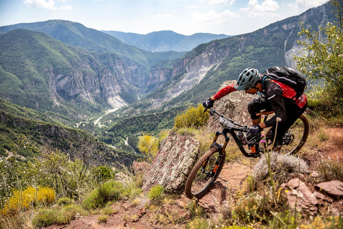 Reign 29 mountain bike on a cliff ledge