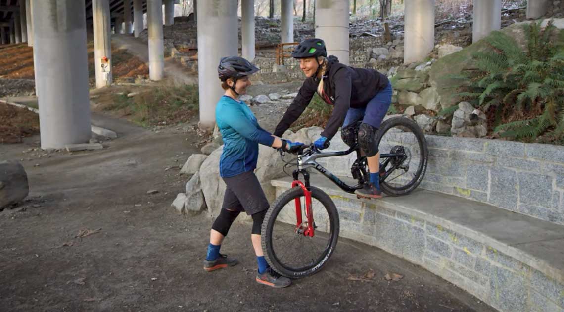 riding downhill bike on road