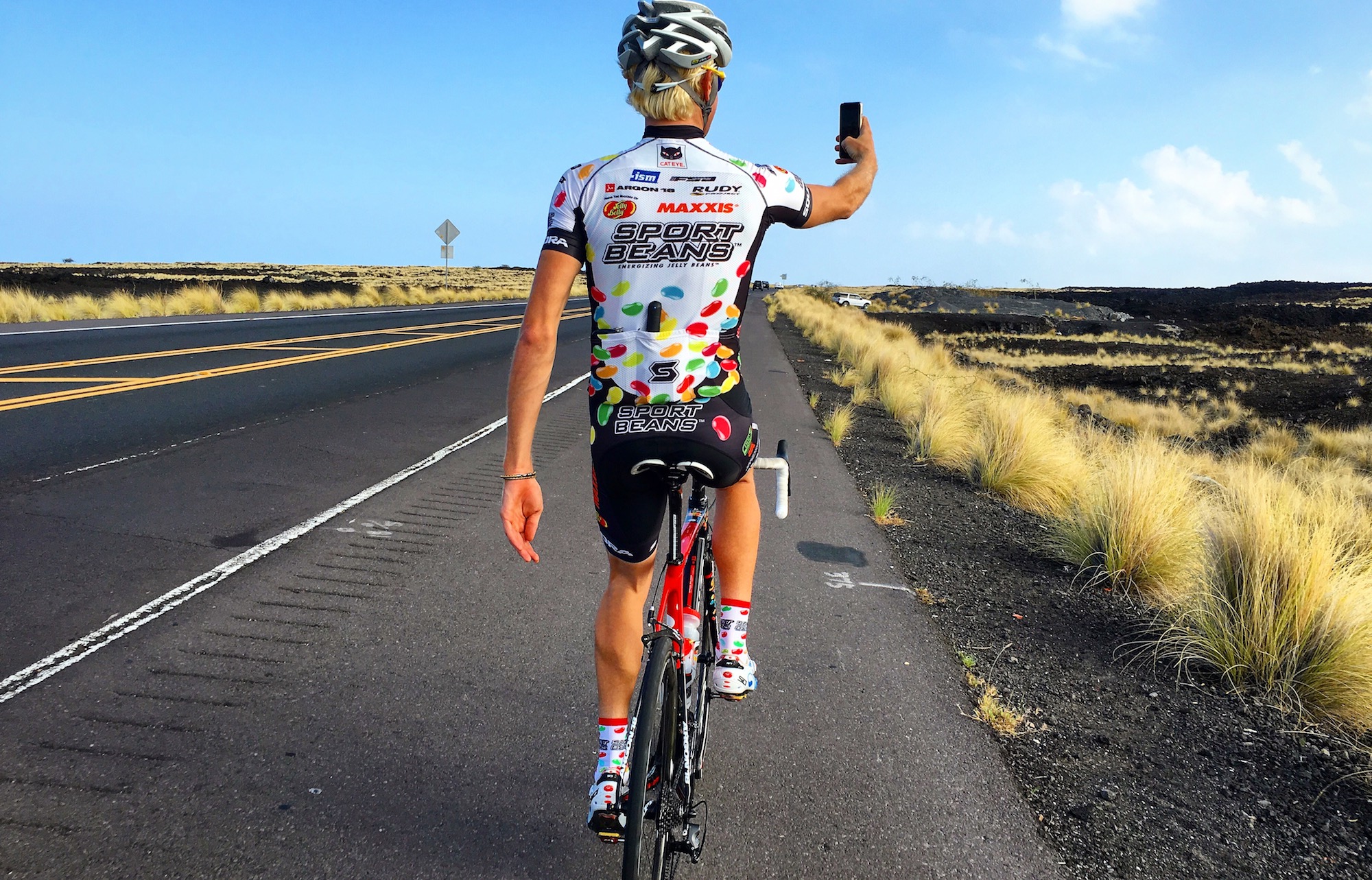 Josh Berry taking a selfie on a road bike